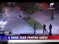 Parlamentul de la Atena a aprobat impunerea unei noi taxe pe proprietatile imobiliare