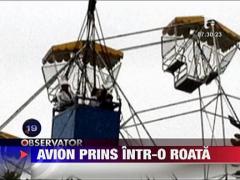 Avion prins intr-o roata panoramica