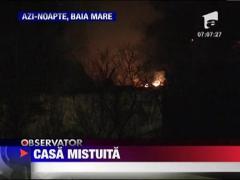 Casa mistuita de flacari in Baia Mare
