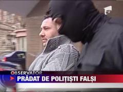 Pradat de politisti falsi