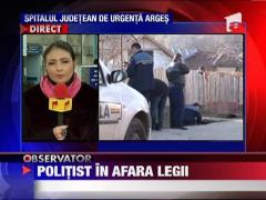Arges: Un politist a impuscat un tanar pe strada, apoi s-a sinucis