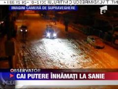 Cu sania legata de masina