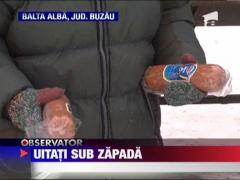 Oameni din judetul Buzau se lupta cu zapada uitati in frig si in bezna!