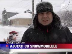 Sinistrati ajutati cu snowmobilele