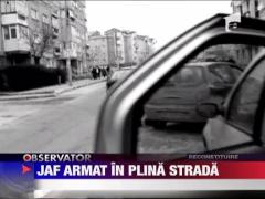 Jaf armat in plina strada