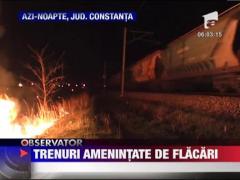 Trenuri amenintate de flacari