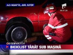 Biciclist tarat sub rotile unei masini