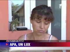 Locuitorii din Stoenesti, judetul Prahova, primesc apa cu "portia"