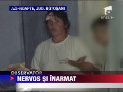 I-a tinut la distanta pe medici si pe politisti cu un topor