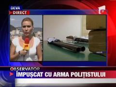 Impuscat mortal cu arma unui politist
