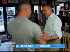 Barack Obama a fost imbratisat si ridicat deasupra solului de catre proprietarul unei pizzerii