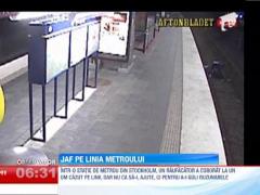 Un hot isi buzunareste victima, pe care o abandoneaza pe sinele de tren