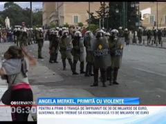 Angela Merkel, primita cu violente