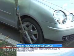 Masini ridicate din fata blocului la Ploiesti