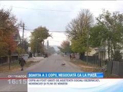 Soarta a trei copii, negociata ca la piata