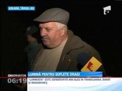 Ziua Mortilor a imbracat cimitirele in flori si lumina