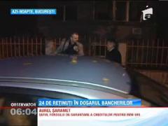 24 de oameni au fost retinuti in dosarul bancherilor