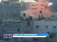 Sute de romani, prinsi intre rachetele si bombele lansate in Fasia Gaza