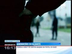 Un om de afaceri din Resita si-a gasit masina gaurita de gloante si un pistol pe capota