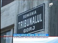Politisti batuti in timpul unei anchete de doi barbati, tata si fiu, in Gorj