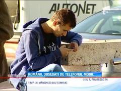 Romanii, obsedati de telefonul mobil