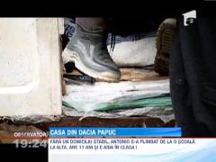 Doi frati isi duc zilele intr-o masina abandonata in curtea unui depozit de fier vechi