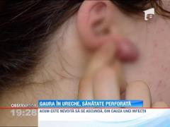 O tanara a ajuns pe masa de operatie dupa ce si-a facut gauri in urechi