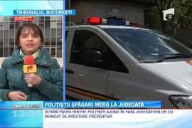 Politistii retinuti pentru luare de mita afla daca vor fi arestati preventiv