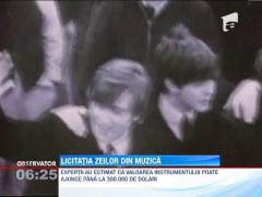 O chitara folosita de John Lennon si George Harrison, scoasa la licitatie