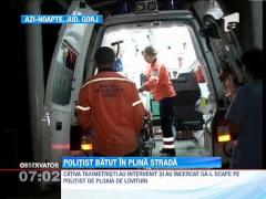 Politist batut in plina strada