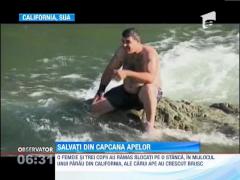 Un parau din California a izolat o familie pe o stanca