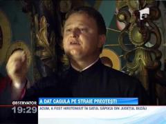 Un politist dintr-un sat buzoian a dat pistolul pe sutana