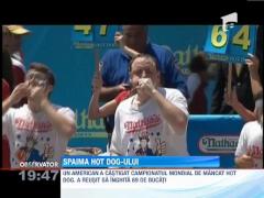 Un american a reusit sa inghita 69 de hot dog-i