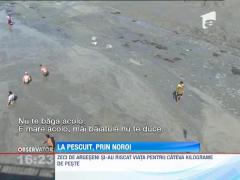 Arges: Zeci de localnici s-au batut in noroi pentru peste