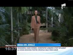 Casa Hermes alansat o colectie de rochii in nuante de verde si gri, intr-un decor luxuriant