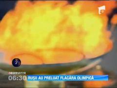 Rusii au preluat flacara olimpica