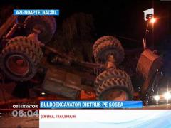 Buldoexcavator distrus pe sosea