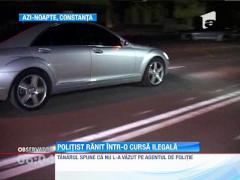 Politist ranit de o masina implicata intr-o cursa ilegala