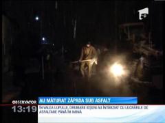În România, asfaltul se toarnă peste zăpadă