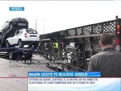 O platformă cu autoturisme abia scoase din fabrică s-a răsturnat la intrarea în Piteşti