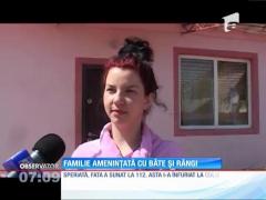 Familie amenințată cu bâte și răngi
