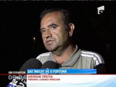 Sat inundat de o furtună