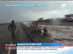 American salvat în ultima clipă din calea unui torent
