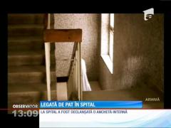Femeie legată de pat în spital
