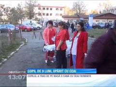 Copil de nouă luni, opărit cu ceai