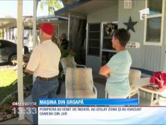 O groapă apărută din senin în faţa unei case din Florida a înghiţit o maşină