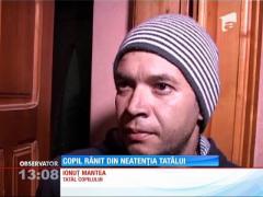 Copil rănit din neatenţia tatălui