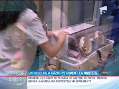 Un bebeluș a căzut pe ciment la naștere