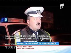 Blindată răsturnată de o maşină mică