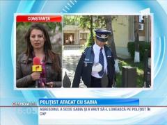 Poliţist atacat cu o sabie
